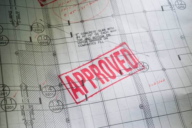 blueprint with the word approved stamped in red